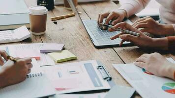 Financial analysts analyze business financial reports on a digital tablet planning investment project during a discussion at a meeting of corporate showing the results of their successful teamwork. video