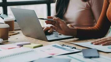 Financial analysts analyze business financial reports on a digital tablet planning investment project during a discussion at a meeting of corporate showing the results of their successful teamwork. video