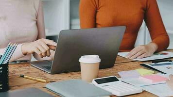 Financial analysts analyze business financial reports on a digital tablet planning investment project during a discussion at a meeting of corporate showing the results of their successful teamwork. video