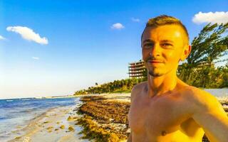 Male tourist Travelling man taking selfie Playa del Carmen Mexico. photo