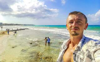 Male tourist Travelling man taking selfie Playa del Carmen Mexico. photo