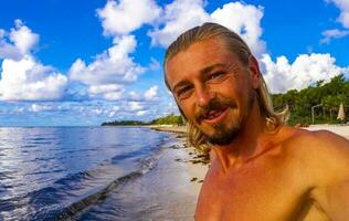 Male tourist Travelling man taking selfie Playa del Carmen Mexico. photo