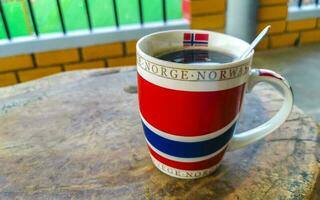 Norwegian coffee cup Norway coffee pot in tropical place. photo