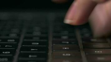 Macro close-up of female hands busy working on laptop or computer keyboard for send emails and surf on a web browser video