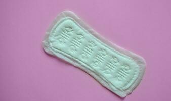 daily padding on pink background, intimate hygiene, womens hygiene, menstruation and critical days, womens health, banner photo