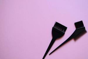 hairdressing brushes on pink background, hair coloring brushes, beauty salon banner, pink background, template photo