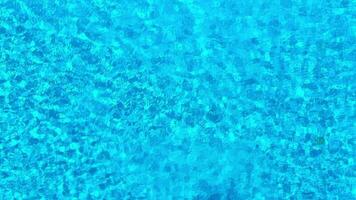 Blue water in the swimming pool. Aerial footage video