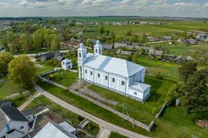 aerial view on neo gothic or baroque temple or catholic church in countryside photo