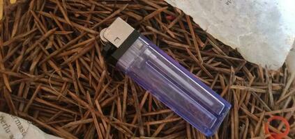 Object Photography - Gas lighter on a pile of twigs photo