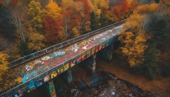 Rustic bridge crosses vibrant autumn forest ravine generated by AI photo