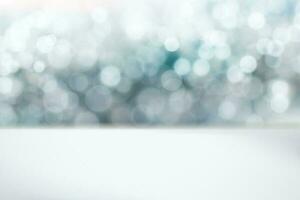 Silver glimmering bokeh background with copy space vector