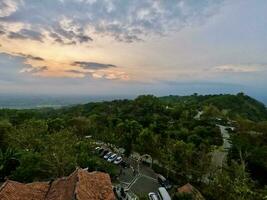 A Captivating Sunset over a Hilltop Landscape photo