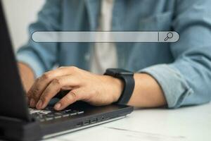 People using laptops use search box icons and copy areas to search for information on the Internet. Technical concepts photo