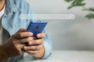 Men's hands on the table use mobile phones, technology, communications, the Internet. photo