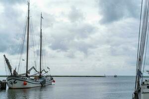 dutch sailing boat on the pier photo