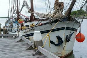 dutch sailing boat on the pier photo