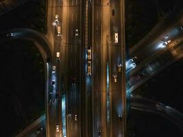 Top view of car traffic transport on crossing multiple lanes highway photo