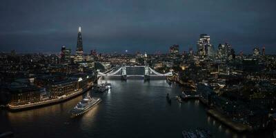 Aerial night view of the Tower Bridge in London. photo