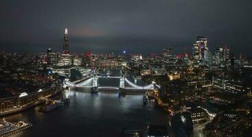 Aerial night view of the Tower Bridge in London. photo