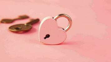 Pink Heart Shape Padlock And Key on table video