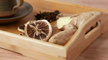 close up of dry lemon, ginger and green tea on table video