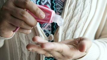 Close up of young woman hand using hand sanitizer spray video