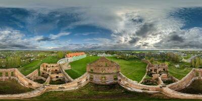 aerial full spherical hdri 360 panorama over stone abandoned ruined palace building with columns at evening in equirectangular projection, VR AR virtual reality content photo