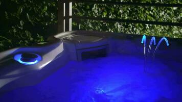 Warm Water Modern Elegant Hot Tub Illuminated by Blue LED Lights video