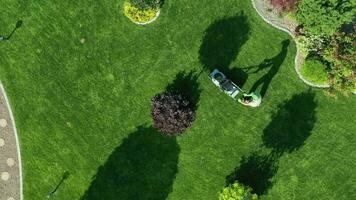 Man On Green Lawn With Mower. video