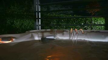 Colors Changing Illuminated Hot Tub Jacuzzi Fountain and Skimmer Close Up video