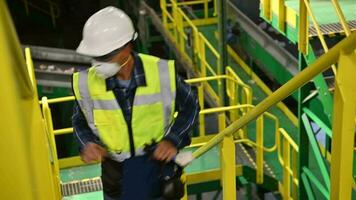 Waste Sorting Facility Manager Walking Along Sorting Warehouse video