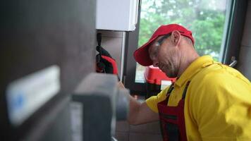 Technician with Gas Leak Detector Performing Scheduled Check video