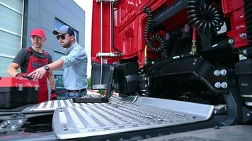 Truck Mechanic and Driver Discussing Some issues video