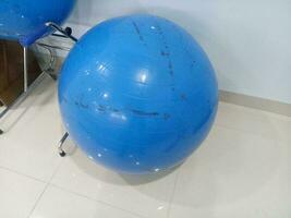 Big blue gym ball in the corner of the room photo