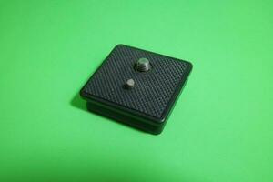 Square tripod mounting for camera in black color photo