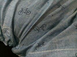 Photo of a gray cloth texture with a bicycle image