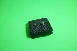 Square tripod mounting for camera in black color photo
