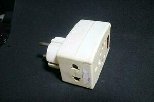 white electric socket with worn out condition photo