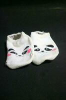 Cute baby socks with panda faces photo