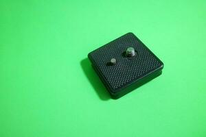 Square tripod mounting for camera in black color photo