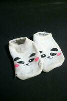 Cute baby socks with panda faces photo