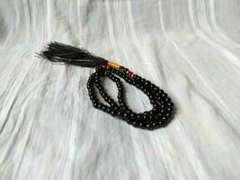 A black tasbih for Muslim prayers photo