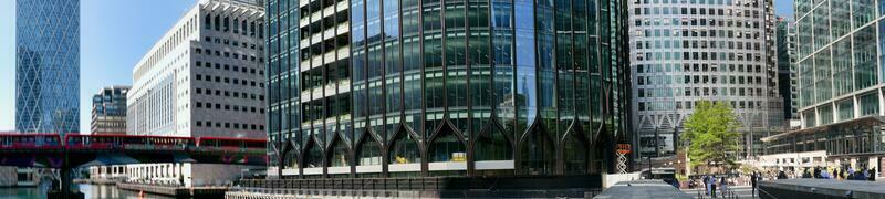 Low Angle Panoramic View of Canary Wharf Buildings at Central London City of England Great Britain. The Footage Was Captured on 08-June-2023 During Clear Day. photo