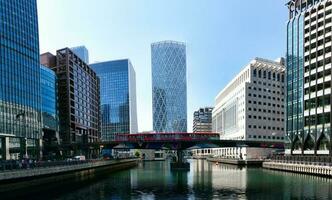 Low Angle Panoramic View of Canary Wharf Buildings at Central London City of England Great Britain. The Footage Was Captured on 08-June-2023 During Clear Day. photo