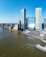 High Angle Panoramic View of Canary Wharf Buildings at Central London City of England Great Britain. The Footage Was Captured with Drone's Camera at Low Altitude on 08-June-2023 During Sunset. photo