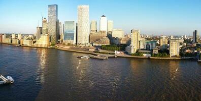 High Angle Panoramic View of Canary Wharf Buildings at Central London City of England Great Britain. The Footage Was Captured with Drone's Camera at Low Altitude on 08-June-2023 During Sunset. photo