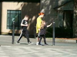 Beautiful Image of People at The Mall Shopping Centre Downtown of Central Luton City of England Great Britain for Shopping and Walking. The Image Was Captured on 02-June 2023 photo