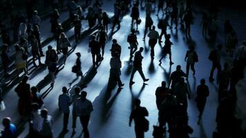 Anonymous unrecognisable crowds of people crossing crowded urban street at rush hour video