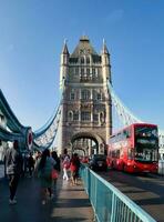 Gorgeous View of People are Enjoying Warm Day of 4-June-2023 at the Edge of River Thames of Central London England UK. Most of the Families and young couples are Walking Around and Enjoying their Time photo