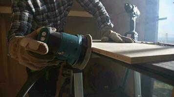 Professional Woodworker Operating Electric Sander to Smooth Wooden Plank video